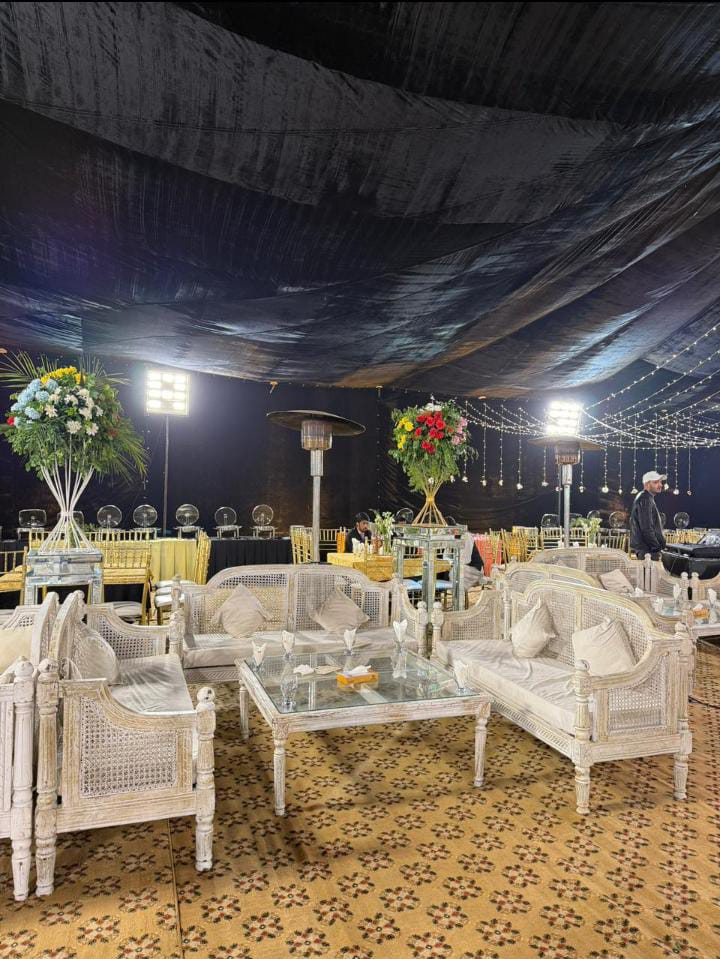 elevated couple stage with floral canopy and warm marquee lighting by Alvi Events & Catering in Lahore (66)