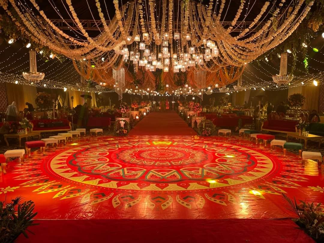 outdoor mehndi seating with floral arch and rainbow hanging tassels by Alvi Events & Catering in Lahore (17)