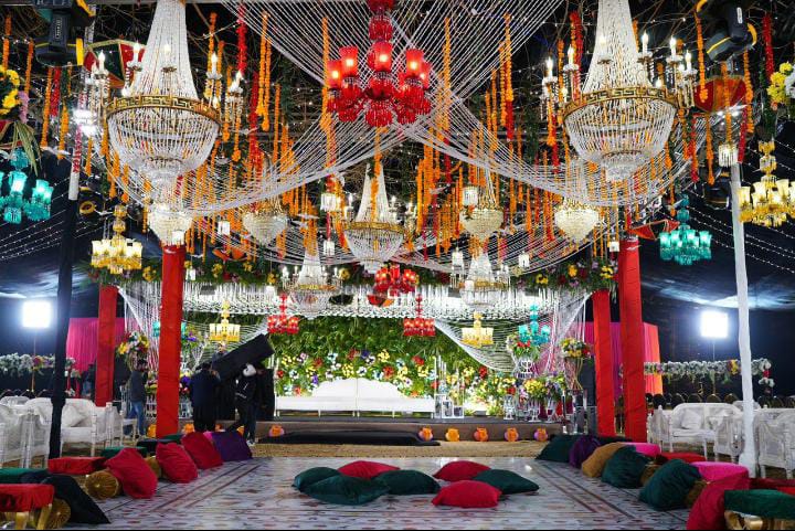 yellow and white floral wedding stage with marigold backdrop by Alvi Events & Catering in Lahore (63)