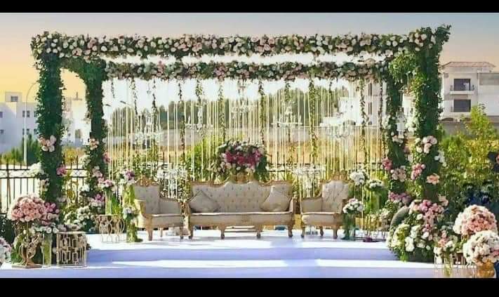 outdoor evening reception table with gold chairs and rose centerpiece by Alvi Events & Catering in Lahore (20)