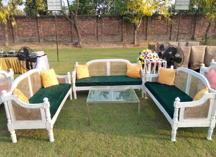 indoor wedding stage setup with ornate sofas and flower backdrop by Alvi Events & Catering in Lahore (53)