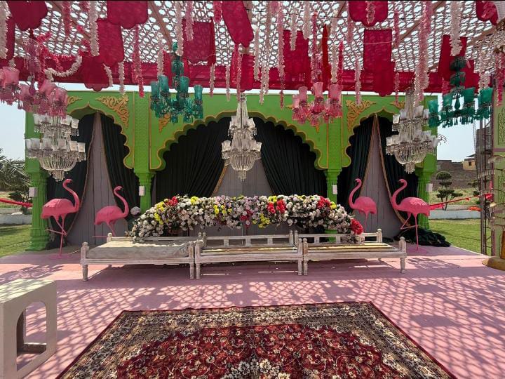 full venue setup with aisle florals, seating, and ceiling draping by Alvi Events & Catering in Lahore (58)